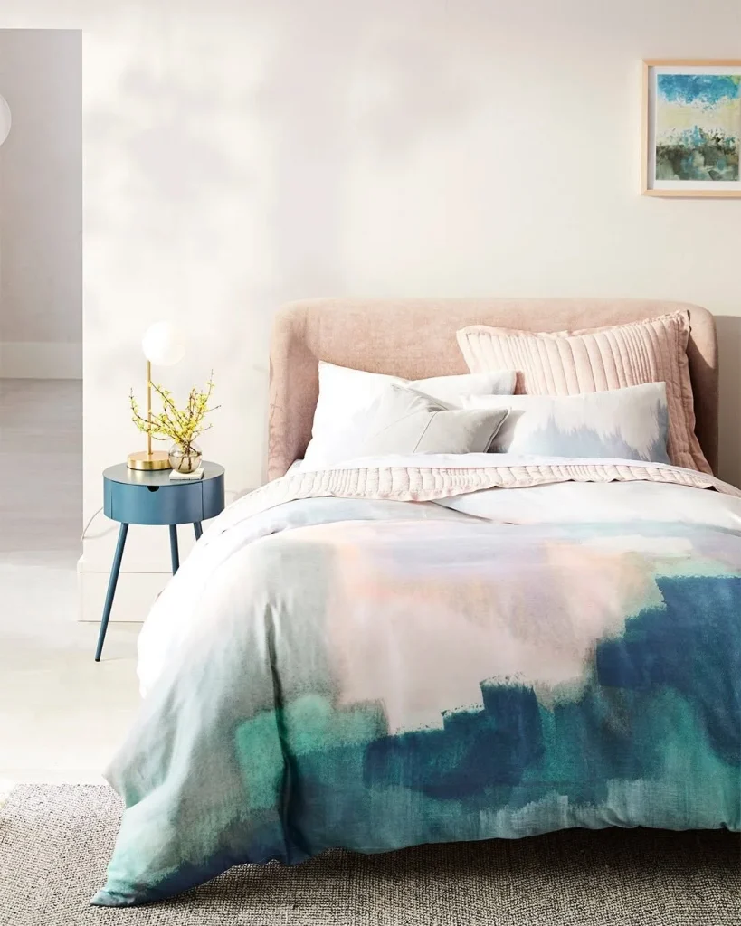 Bright white small bedroom with soft color palette to look bigger