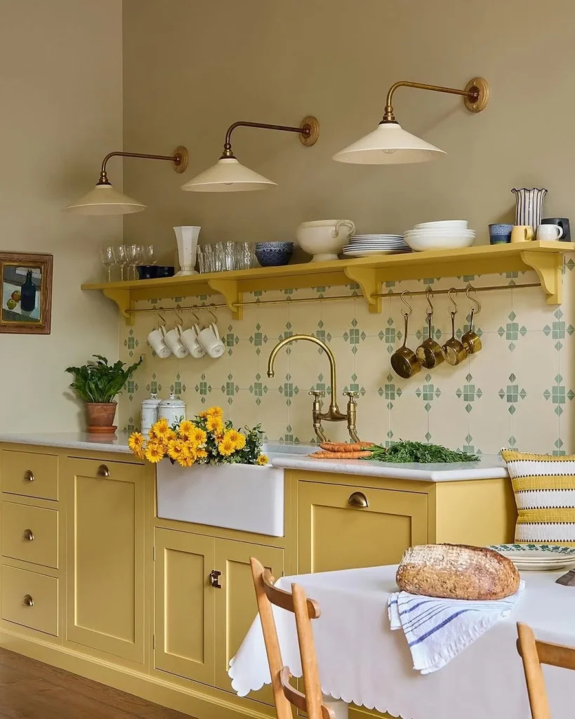 Cheerful Cottage Kitchen with Golden Cabinets and Wall Sconces