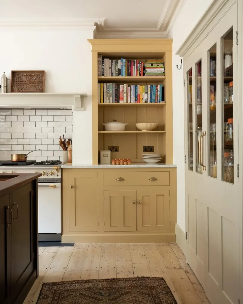 Classic Butter Yellow Bookcase Kitchen with Subway Tile