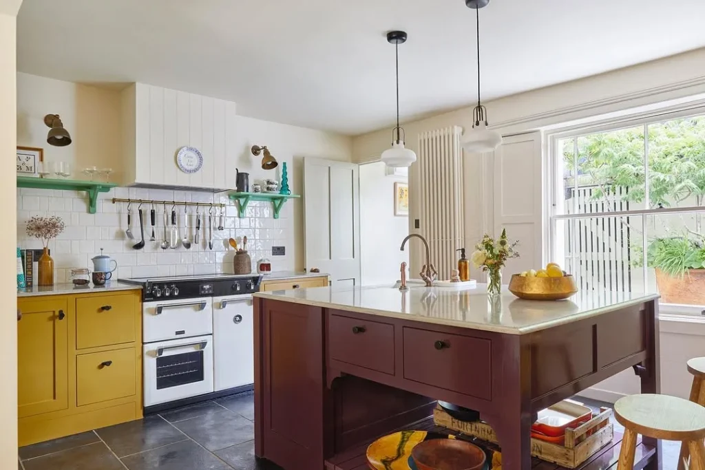 Eclectic Butter Yellow Kitchen with Jewel-Toned Island