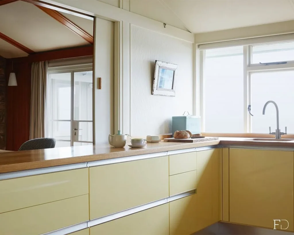 Retro Modern Butter Yellow Kitchen with Wood Accents