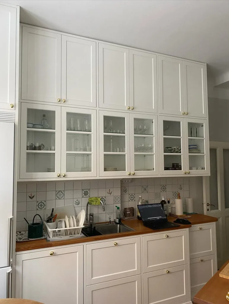 Retro-Style Butter Yellow Kitchen with Patterned Tiles