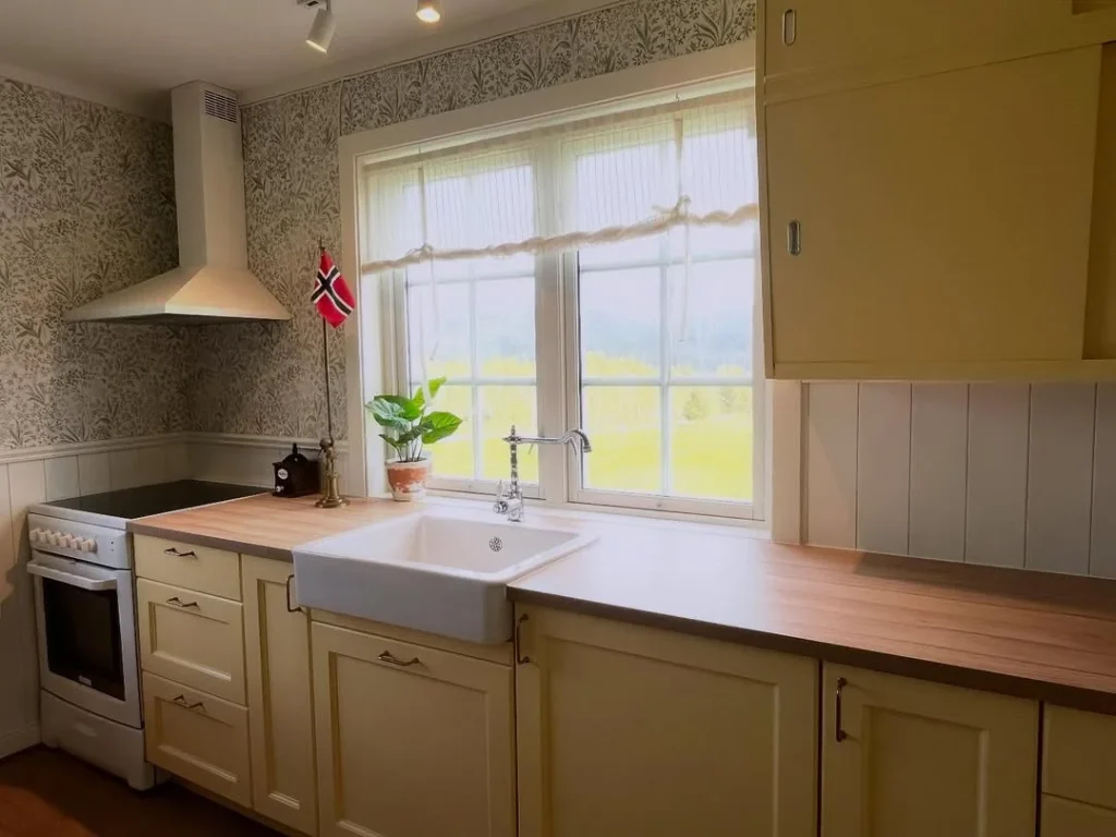 Scandinavian-Style Butter Yellow Kitchen with Wallpaper