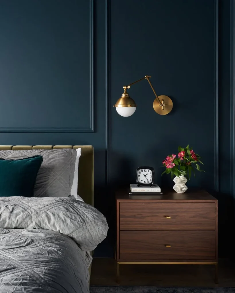Sophisticated Blue Bedroom with Brass Wall Sconce